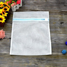 Large mesh laundry bag with zipper, suitable for delicate clothing and travel storage.