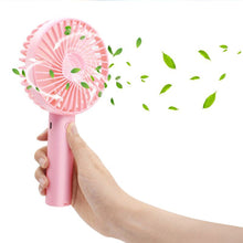 Portable handheld fan for summer use, ideal for home and office.