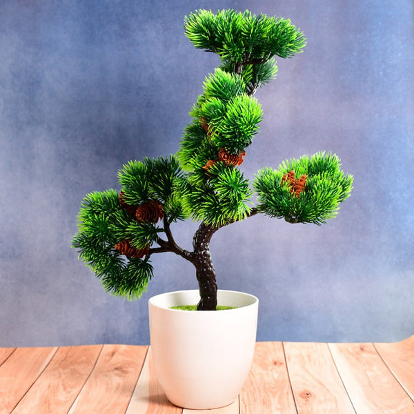 Artificial potted plant in a round white pot