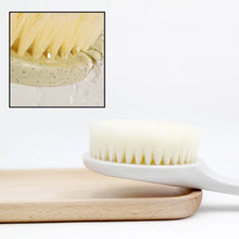 Long handle soft bristle brush for exfoliating and massage.